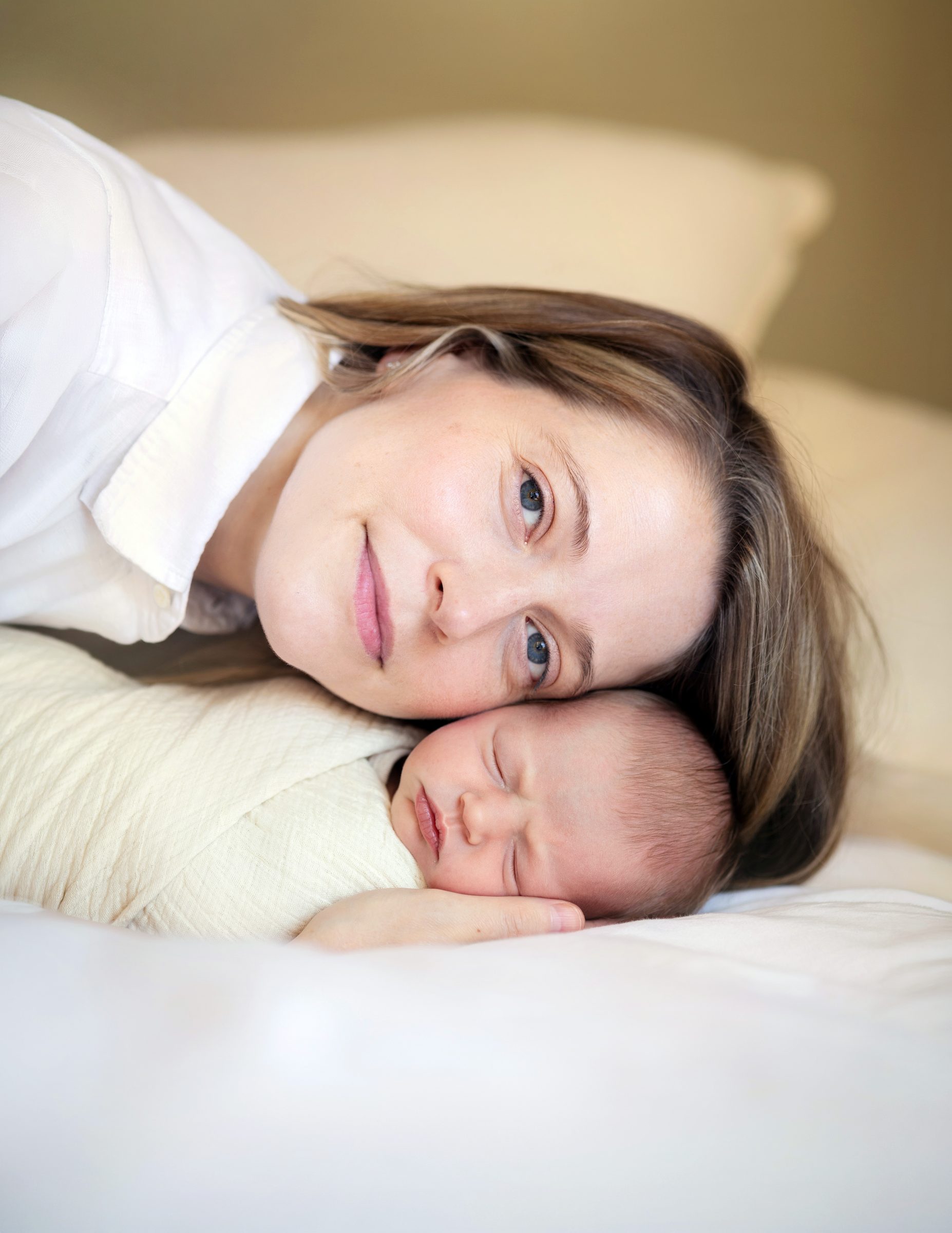 Mother resting with her newborn baby